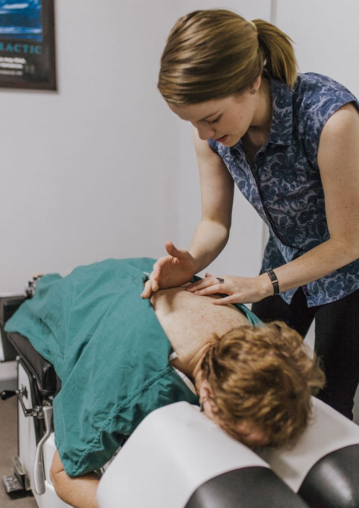 Esther treating a customer's back